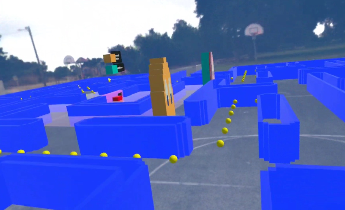 Blue maze walls and yellow pellets laid over a real outdoor basketball court